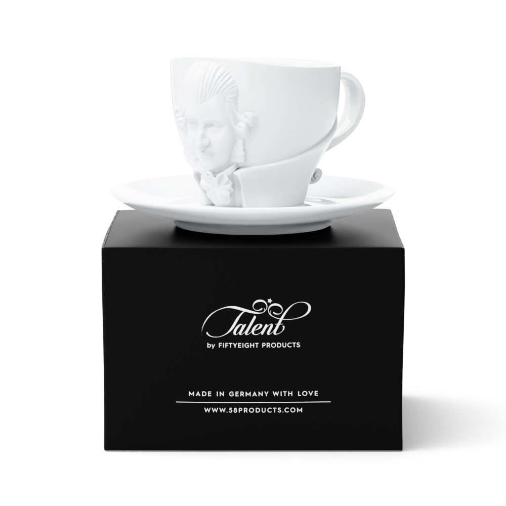 Premium porcelain coffee cup with saucer in white with sculpted Wolfgang Amadeus Mozart face. Dishwasher and microwave safe cup at 8.7 oz capacity. From the TALENT product family of cups dedicated to creative geniuses by FIFTYEIGHT Products. Made in Germany according to environmental standards.