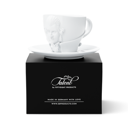 Premium porcelain coffee cup with saucer in white with sculpted Wolfgang Amadeus Mozart face. Dishwasher and microwave safe cup at 8.7 oz capacity. From the TALENT product family of cups dedicated to creative geniuses by FIFTYEIGHT Products. Made in Germany according to environmental standards.